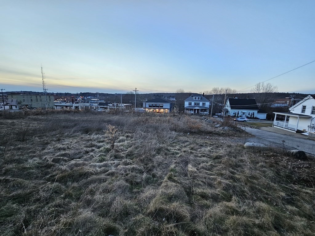 empty area of land surrounded by buildings