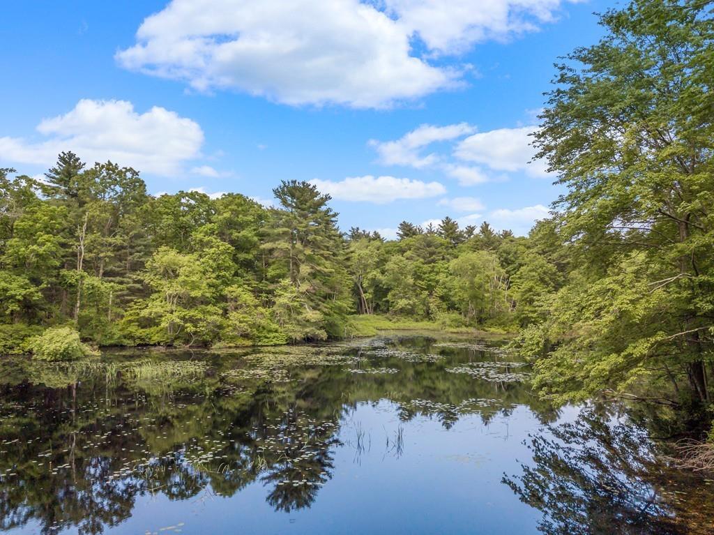 residential land surrounded by water and a beautiful sky